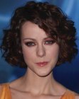 Jena Malone with short curled hair