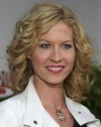 Jenna Elfman sporting medium long hair with curls