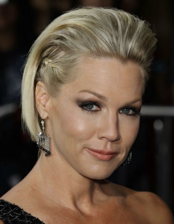 Jennie Garth wearing her short hair with the sides braided close to her head