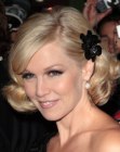 Jennie Garth sporting short curly hair