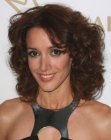 Jennifer Beals rocking a medium length hairdo with curls