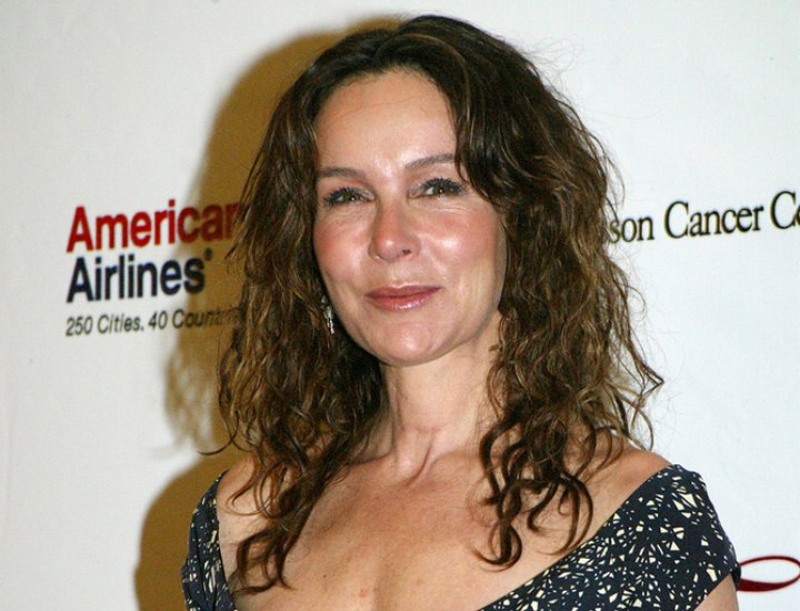 Jennifer Grey wearing her natural curly hair long