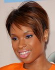 Jennifer Hudson sporting a brown pixie cut