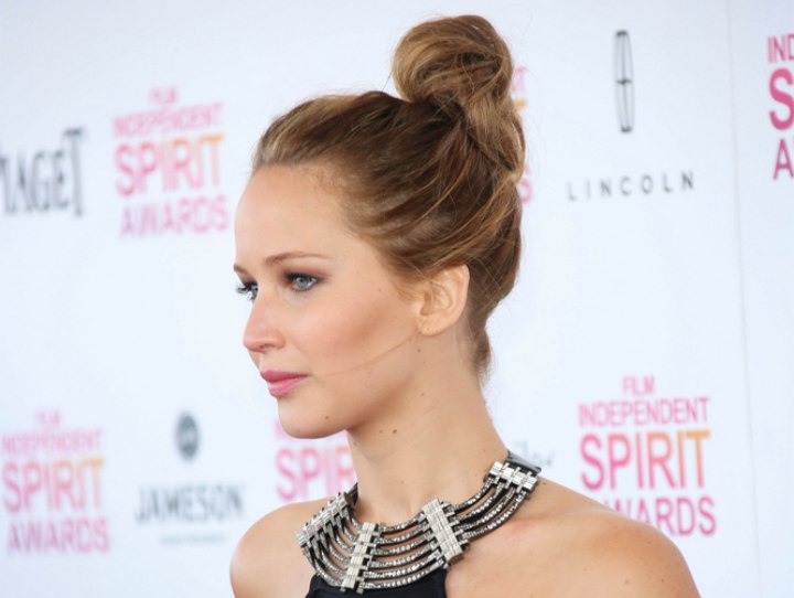 Side view of Jennifer Lawrence's top knot updo