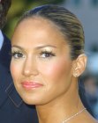 Jennifer Lopez with her hair styled into a tight bun