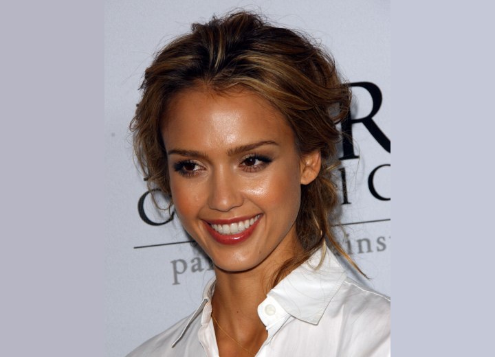 Jessica Alba with her hair in a loose up style