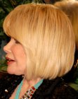 Joan Rivers sporting a blonde bob with bangs