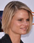 Joelle Carter wearing her blonde hair in a one length bob