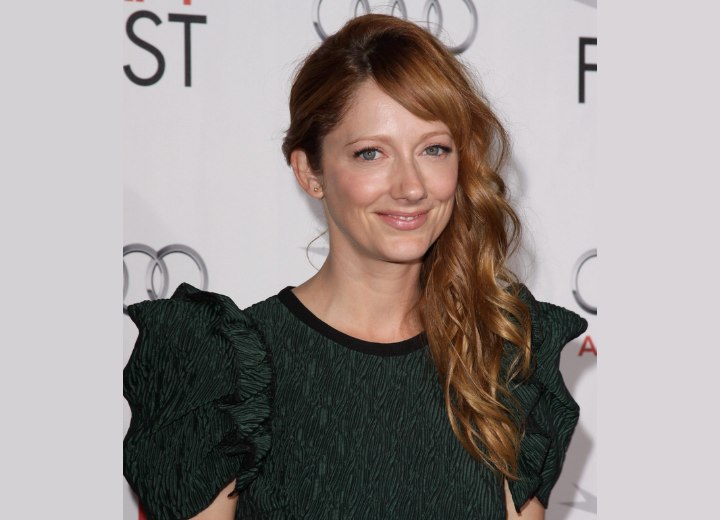 Redhead Judy Greer with long curled hair