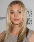 Kaley Cuoco with angled hair cuffed around her face
