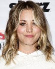 Kaley Cuoco's long blonde hair with highlights, layers and curls
