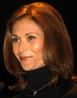 Kate Jackson wearing her brown hair in an easy shoulder length style