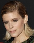 Kate Mara sporting a long above the shoulders bob with slicked-back styling