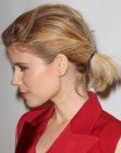 Kate Mara with her medium length hair styled into tousled ponytail
