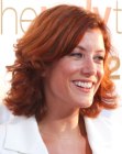 Kate Walsh's medium length hairstyle with layers and flips around her head