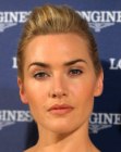 Kate Winslet with her hair pulled into a short ponytail