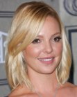 Katherine Heigl wearing medium length hair with a side part