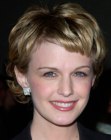 Kathryn Morris wearing her hair short and trendy in a pixie