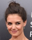 Katie Holmes wearing her hair up in an informal bun