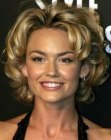 Kelly Carlson with short curled hair