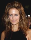 Kelly Preston wearing her hair with the crown pulled back
