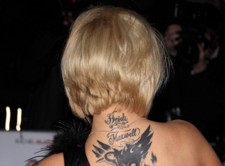Kerry Katona's hair with a short layered nape and her tattoo