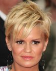 Kerry Katona with a very short haircut featuring bangs