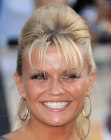 Kerry Katona wearing her blonde hair in a ponytail