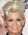 Kerry Katona with hair tucked behind her ears