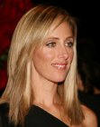 Kim Raver with a blunt cut long hairstyle
