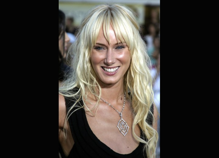 Kimberly Stewart with waist long blonde hair