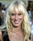 Kimberly Stewart's long waist length hair with wild waves