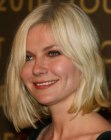 Kirsten Dunst wearing her hair in a not too short bob with a side part
