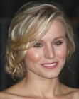 Kirsten Bell's updo with braiding