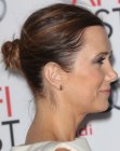 Kristen Wiig wearing her hair in a knot