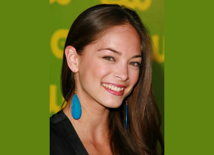 Kristin Kreuk's long hair styled behind one ear