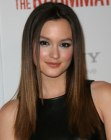 Leighton Meester wearing long and sleek brown hair with angled sides