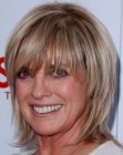 Linda Gray's not too short razor cut shag hairstyle with long bangs