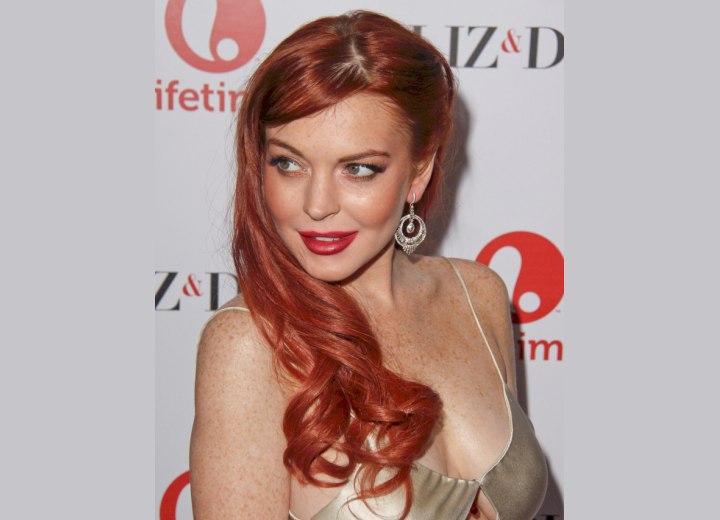 Lindsay Lohan with long hair styled behind her ear