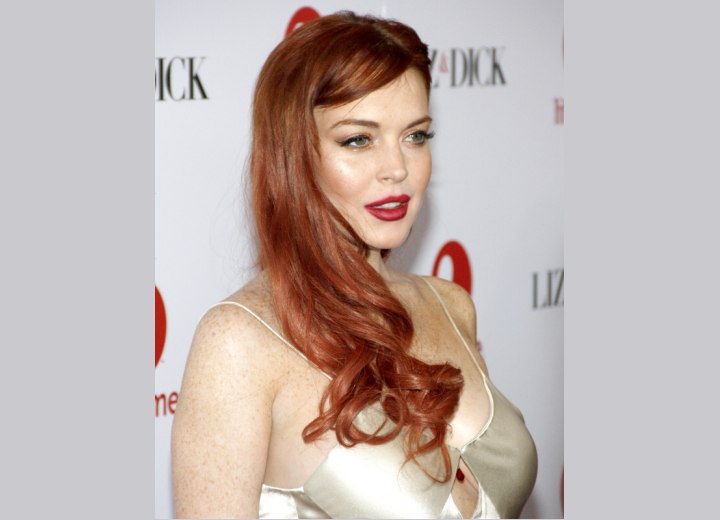 Lindsay Lohan wearing her hair styled over one shoulder