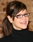 Lisa Loeb wearing her hair in a sleek and stylish ponytail