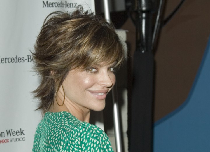 Lisa Rinna wearing her short hair pulled behind the ears