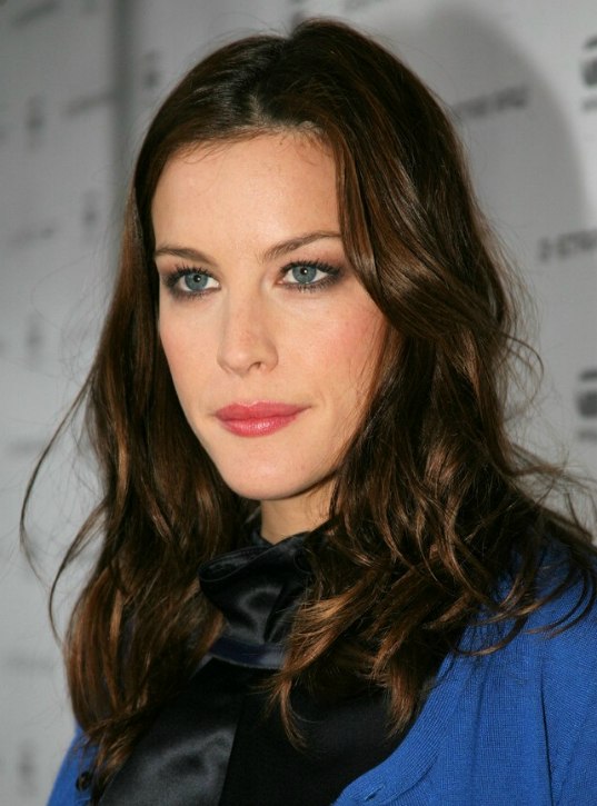 Liv Tyler with her choclocate colored long hair sectioned 