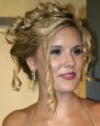 Maggie Grace's up-style with loose tendrils and spiral curls
