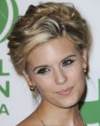 Maggie Grace with her hair styled up and looking short