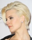 Maggie Grace's short hairstyle with one side tucked behind her ear