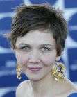 Maggie Gyllenhaal with her hair cut short