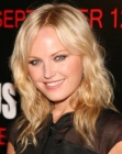 Malin Akerman with blonde hair styled into waves
