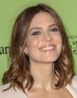 Mandy Moore wearing her shoulder length hair in a soft and curly bob