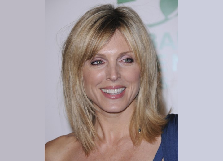 Marla Maples shoulder tipping blonde hair with an angled cutting line